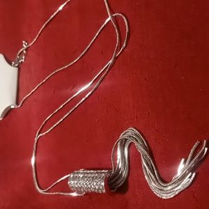 Long Silver tone tassel necklace 34 +3 inches long. Snake chain & matchin tassel